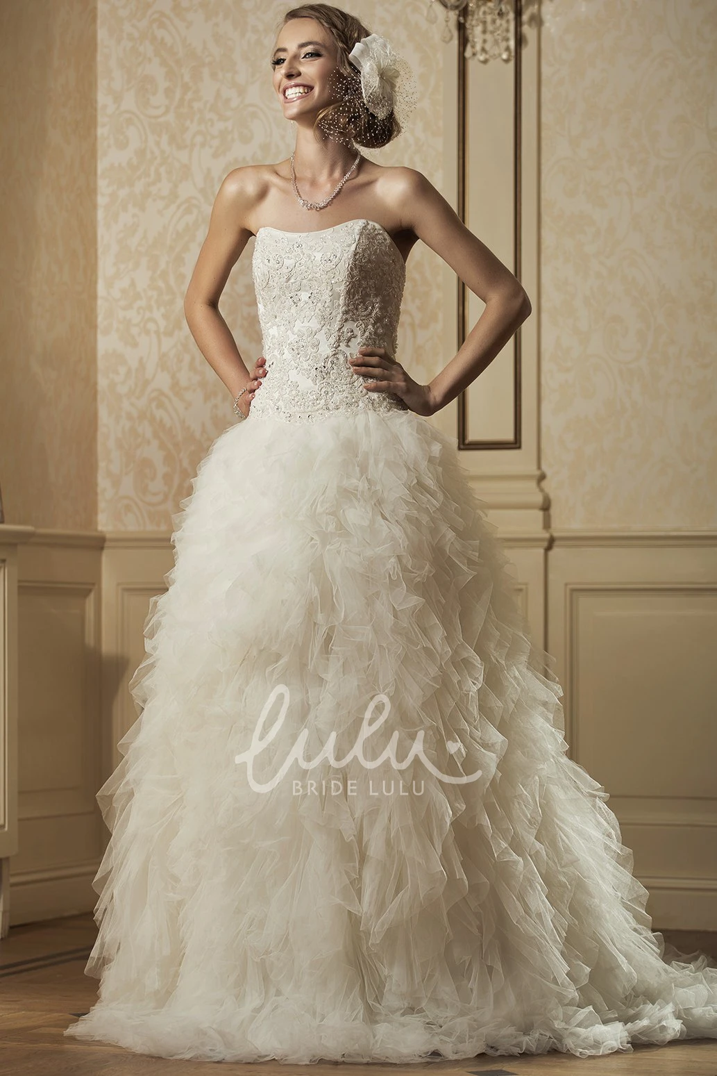 Beaded and Appliqued Ball Gown Wedding Dress with Strapless Ruffles and Tulle