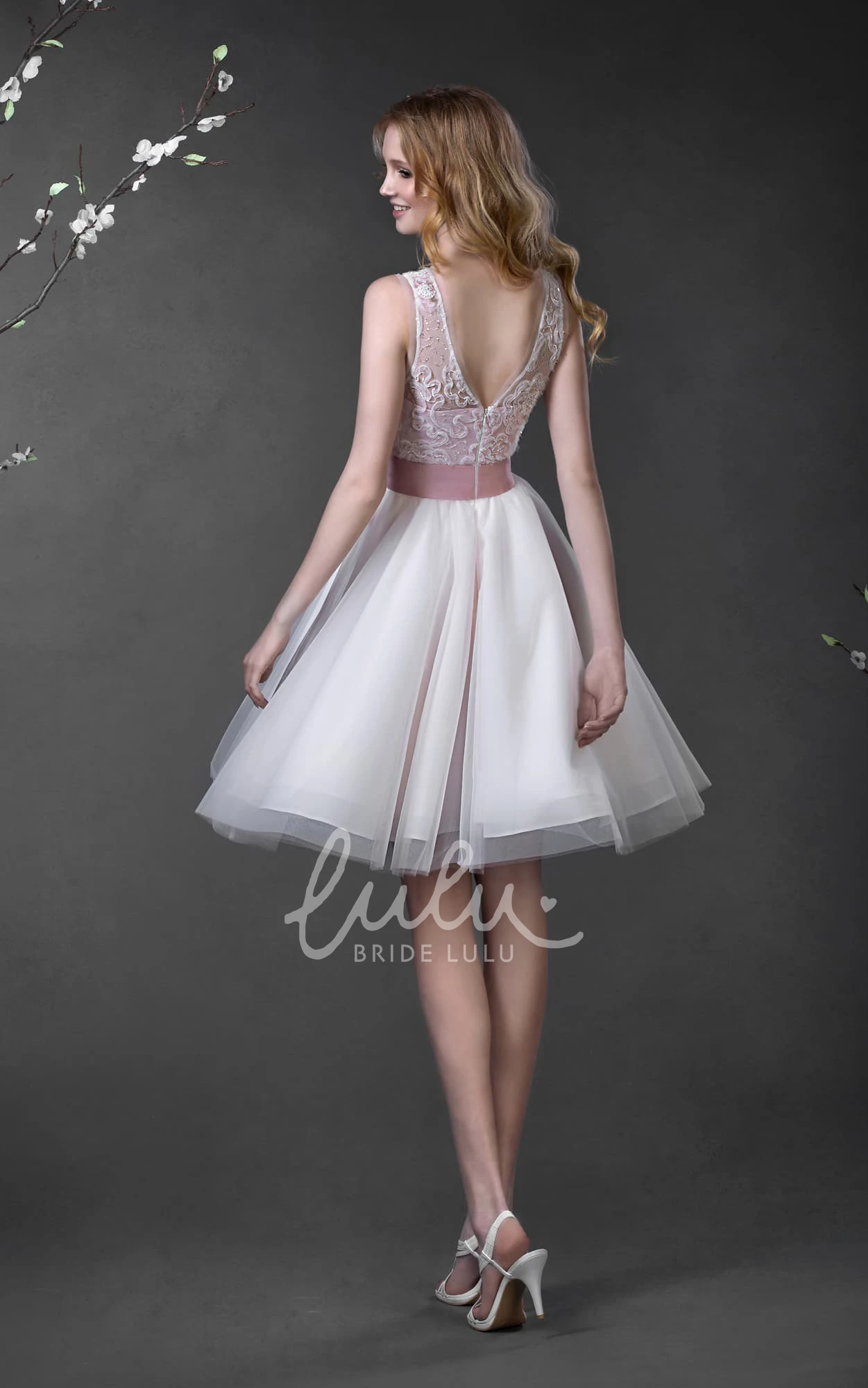 Lace Tulle A-Line Spring Wedding Dress with Low-V-Back Bow and Sleeveless Design