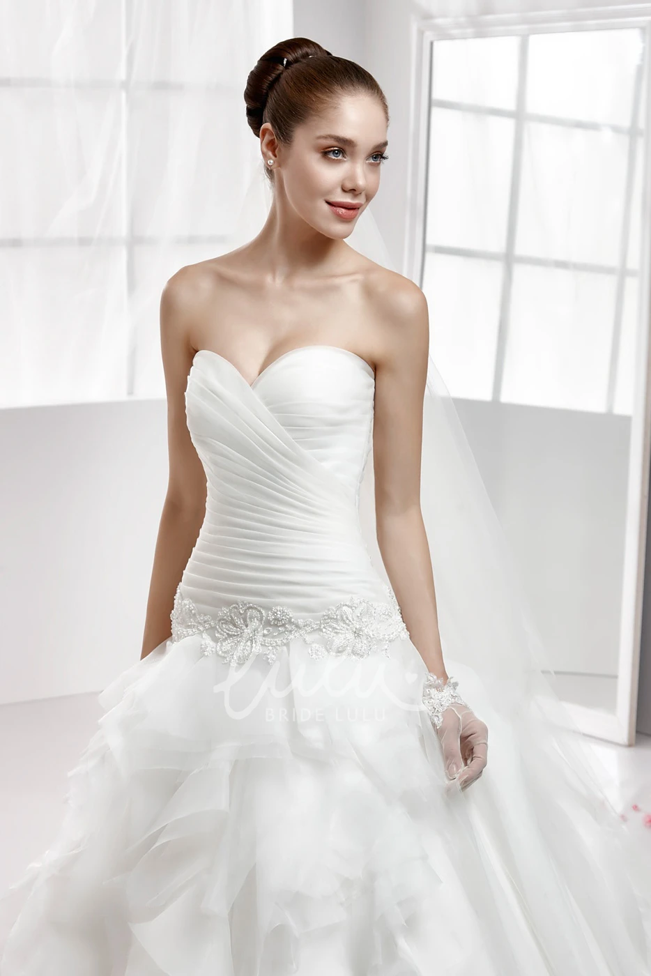 Beaded Wedding Dress with Cascading Ruffles and Pleated Bodice