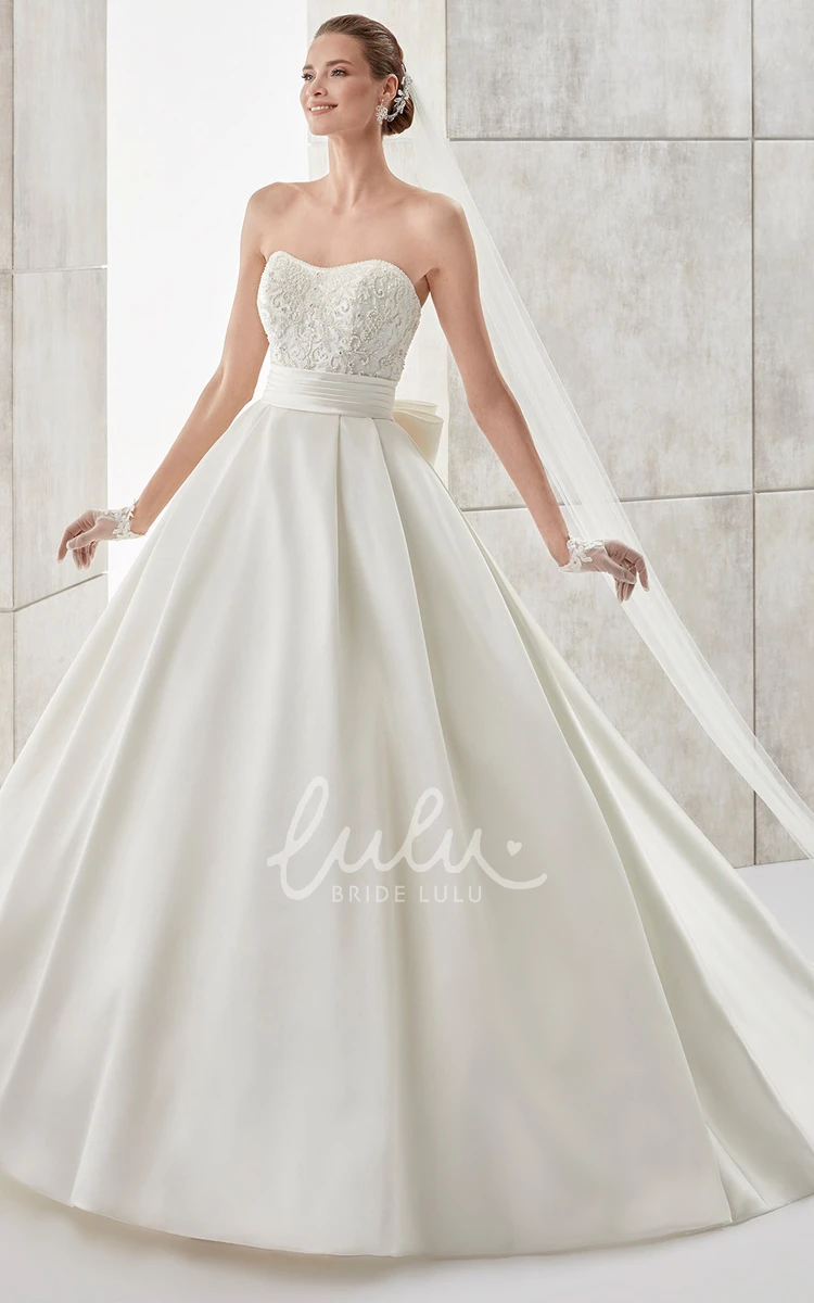 A-line Wedding Dress with Strapless Neckline Cinched Waistband and Back Bow