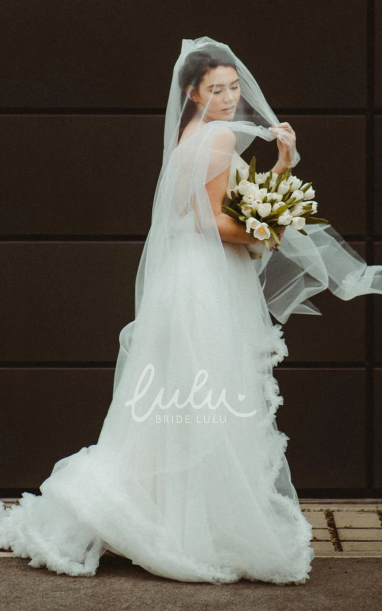 Romantic Tulle A Line Wedding Dress with Tiers and Spaghetti Neckline